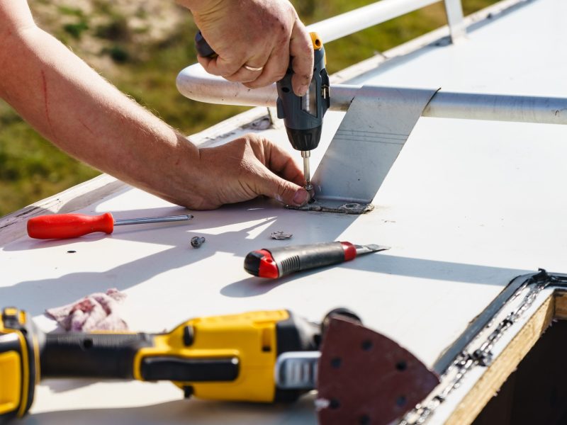 Male,Hands,Repair,Caravan,Motor,Home,Roof.